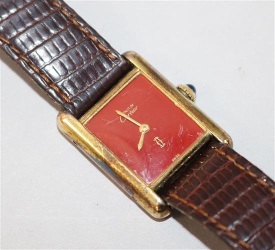 A ladys silver gilt Must de Cartier manual wind wrist watch.